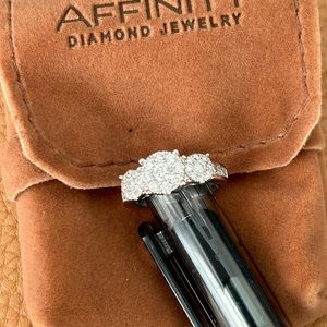 14K WG diamond weight is approximately 1 carat, 3 stone cluster design.